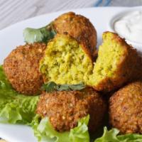 Falafel · 6 pieces. Chick pea croquettes mixed with fresh vegetables and Mediterranean spices.