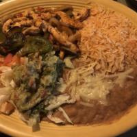 Fajitas · Your choice of chicken or beef, served with rice, beans, lettuce, pico de gallo, sour cream ...