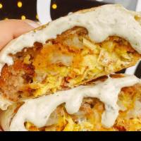 Breakfast Wrap · Dos Croquetas + Bacon crumble + Shredded cheese + Scrambled eggs with our house made sauce i...