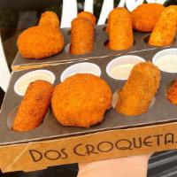 12 | Croqueta Flight™ + Sauces · Mix and match 12 craft croquetas & sauces with your very own Croqueta Flight™. If you’re dou...