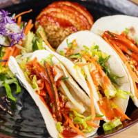 Taco Plate · 3 tacos of your choice with two sides. Carrot, cucumber and lettuce with a flour tortilla.