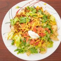 Nachos Grande · Vegan tortilla chips heaped with chili, melted vegan Cheddar cheese, lettuce, tomatoes, jala...