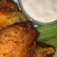 Wing Combo · Wings tossed in our custom sauce of choice and served with fries and celery. (Hot, lemon pep...
