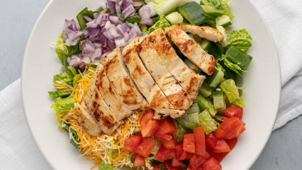 Grilled Chicken Salad · GRILLED CHICKEN + ROMAINE LETTUCE + TOMATOES + CUCUMBER + PURPLE ONION + CHEDDAR & MONTEREY JACK CHEESES