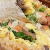 Steak & Egg Burrito · Carne asada scrambled eggs guacamole and Oaxaca cheese.