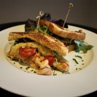 Vin Blanc Lobster Grilled Cheese · Butter Poached Lobster, Swiss Cheese, Roasted Tomatoes, Onions on Toasted Brioche.