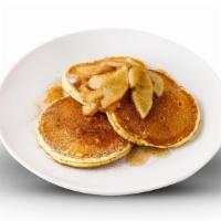 Cinnamon Apple Pancakes · 6 buttermilk pancakes topped with cinammon and caramelized apples. Served with warm apple sy...