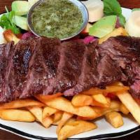 Chimichurri Churrasco · 10oz angus skirt steak served with rice and fried patacones