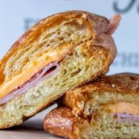 Croissant With Ham & Cheese · Ham, American cheese, and butter in a croissant bun.
