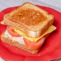Tuna Melt Sandwich · Tuna salad, tomato, American melted cheese, and sandwich bread.