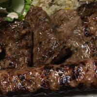 Beef Kofta Kebab Platter · Minced beef with garlic and herbs grilled on a skewer. Served with rice or hummus, lettuce, ...
