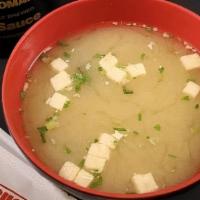 Miso Soup · Briny miso broth with seaweed, green onions and tofu.