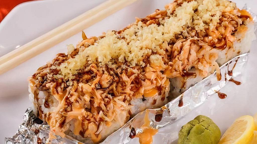 Volcano Roll · California roll topped with baked krabmeat, spicy mayo, eel sauce, crunchy flakes and fully baked.