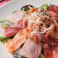 Spicy Sashimi Salad · Three sashimi rockstars—red tuna, salmon, yellowtail—crab stick and cucumber piled on spring...