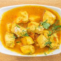 Chicken Curry · Chicken curry cooked with tomatoes and fresh onions with herb spices.