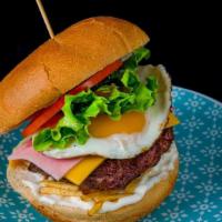 La Venezolana Burger · Black Angus Beef pattie, ham, cheese, lettuce, tomato, egg, potato sticks, and specialty sau...