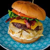 La Colombiana Burger · Black Angus beef pattie, bacon, cheese, lettuce, tomato, crushed potato chips, pineapple, an...