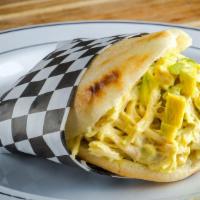 Arepa De Reina Pepiada · Shredded Chicken Salad with Avocado and Secrect mix Sauce.