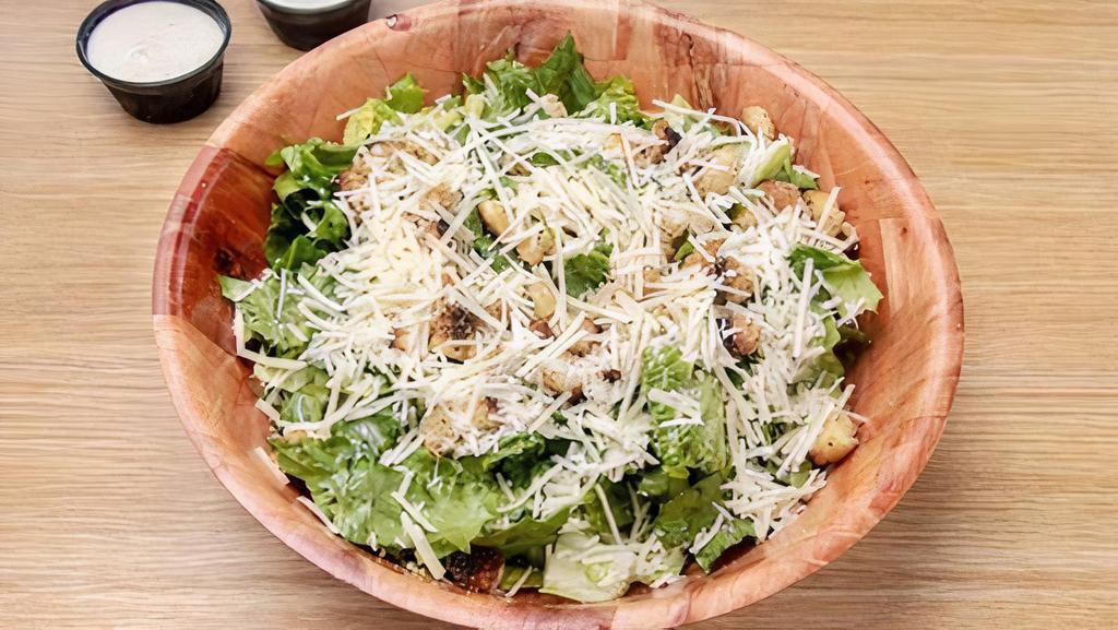 Small Caesar Salad · Romaine, Parmesan, Croutons Served With. A Creamy Caesar Dressing