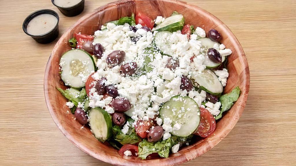 Small Greek Salad · Mixed Greens, Tomatoes, Kalamata Olives, Onions, Cucumbers, Feta Cheese Banana Peppers, And A Greek Vinaigrette