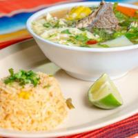 Caldo De Res · Mexican style beef soup with vegetables and a side of rice.