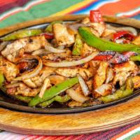 Fajitas · Fajtas cooked with onion, red and green peppers and your choice of meat. Served with avocado...