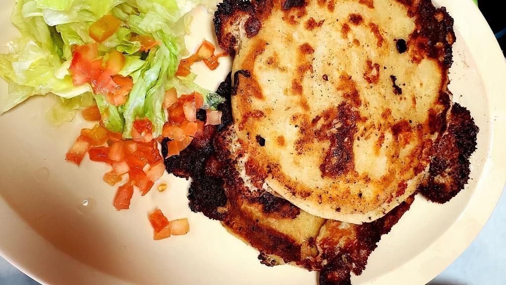 Pupusas · Handmade tortilla filled with your choice of filling