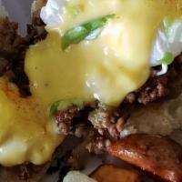 Penman Benny · Fresh ground beef, onion, green peppers and penman seasoning, two poached eggs with hollanda...