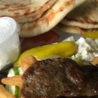 Gyro Platter · Thinly sliced gyro meat, greek salad with tzatziki sauce, pita on the side, and french fries.