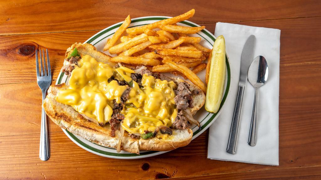 Philly Cheesesteak · Thinly sliced ribeye steak with onions and peppers, mushrooms, and american cheese.