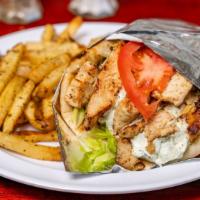 Chicken Pita · Wrapped in pita with tzatziki sauce, lettuce, tomatoes, and onion.