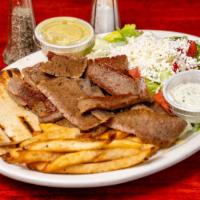 Gyro Platter · Gyro cone slices from vertical spit fire served with greek salad french fries, pita and tzat...