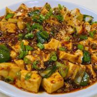 Mapo Tofu · Spicy. Soft tofu with ground pork and scallions.