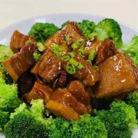 Taiwanese Style Braised Pork · Spicy. Cilantro garnish.