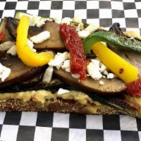 Secret Garden · Grilled Portobello mushrooms, grilled zucchini, grilled peppers, sundried tomatoes, Feta che...