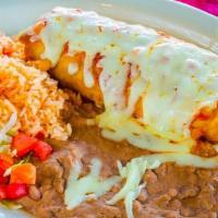 Chimichanga · Sour cream, guacamole, ranchero sauce on top, and melted cheese. served with mexican rice, r...