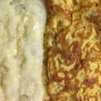Omelets Western · Green peppers, onion, tomatoes, cheese and choice of meat. Served with toast and grits or po...