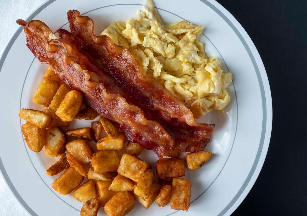 Rise & Shine · 2 eggs any style served with grits or potatoes, choice of bacon, sausage or ham (substitute corned beef hash for additional cost), and toast.