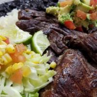Carne Asada · Grilled skirt steak, served with side salad, guacamole, rice and beans.