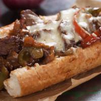 Chicken Philly Sandwich · Shredded beef, green peppers, onions and cheese on Cuban or sweet bread.