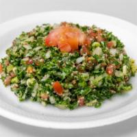 Tabouleh Salad · Parsley, cracked wheat, tomatoes, green onion, lemons and oil. Vegetarian.