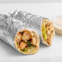 Chicken Shawarma · Marinated tender strips of chicken wrapped with tomatoes, lettuce, onions, topped with tahin...