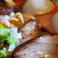 Spicy Tonkotsu Ramen · Homemade pork broth, pork chashu, seasoned egg, scallion, white onion, spinach, bamboo shoot...