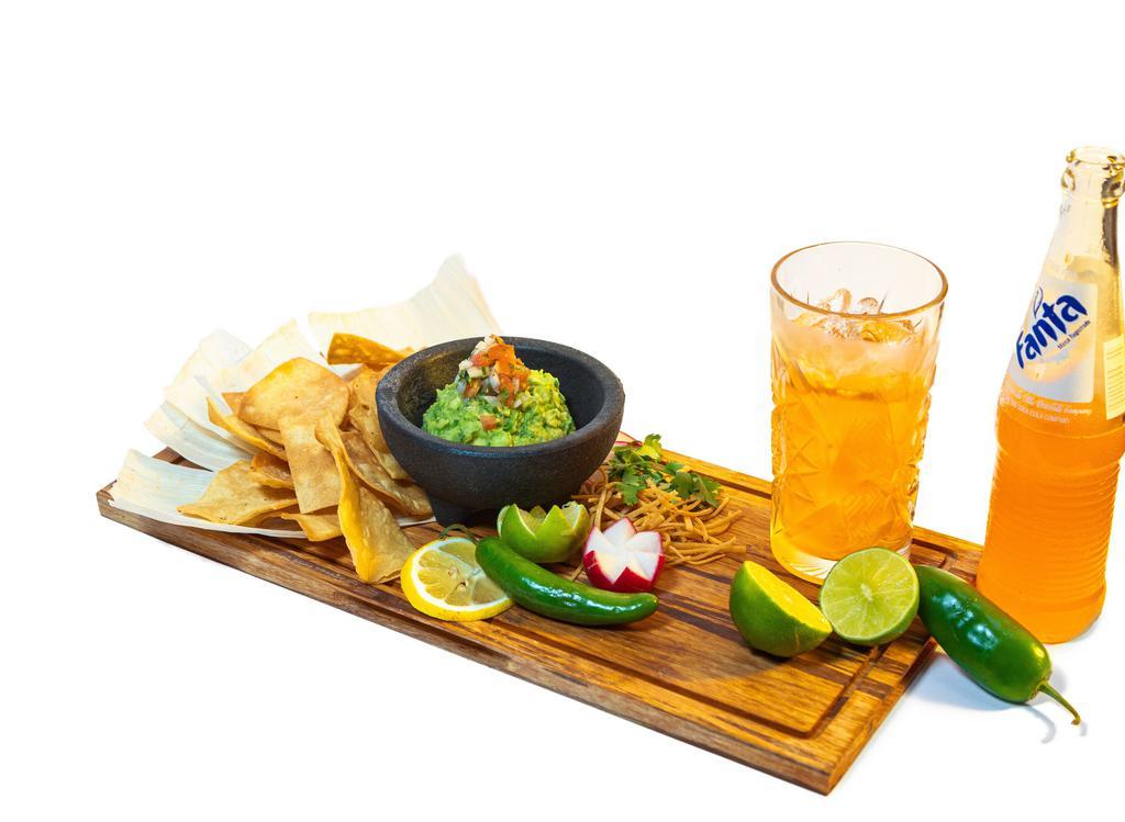 Guacamole & Chips · A piece of Mexico in our hearts! Fresh hass avocado, seasoned with condiments, diced tomato, onion, cilantro a squeeze of lime topped with pico de gallo and fried real corn tortilla chips.