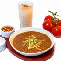 Sopa De Lenteja · Homemade lentil soup, diced veggies, vegetable broth on a totmato base sauce with your choic...