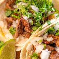 Steak Tacos (Order Of 3) · Soft corn or flour tortilla with diced NY steak meat topped with onion , cilantro and lime. ...