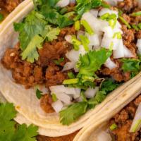 Ground Beef Tacos (Order Of 3) · Soft corn or flour tortilla with ground beef topped with onion , cilantro and lime. Side of ...