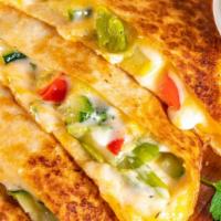 Veggie Quesadilla · 12 inches flour tortilla, stuffed with veggies, whole milk mozarella cheese, served with a s...