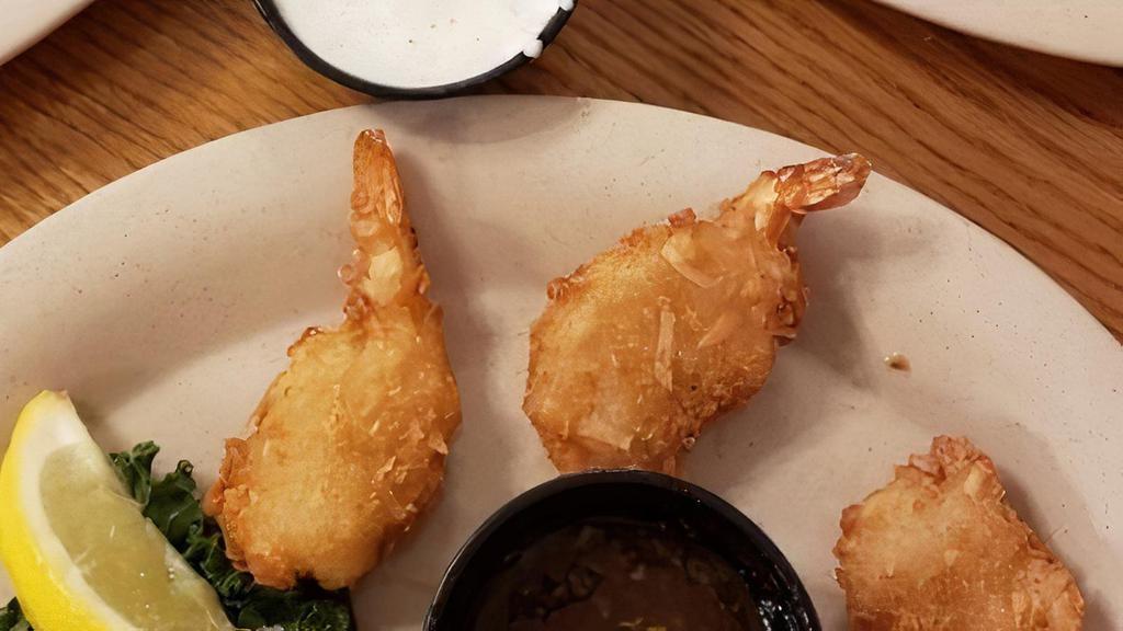 Coconut Shrimp · Shrimp rolled in a light coconut breading and then fried. Served with a sweet and spicy sauce.