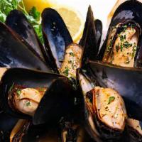 New Sautéed Garlic Mussels · A classic delicacy, one full pound of tender mussels sautéed with scampi butter and served w...